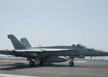 An F/A-18E Super Hornet lands on the flight deck