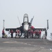 U.S. Sailors tend to an F/A-18E Super Hornet assigned to Strike Fighter Squadron (VFA) 97