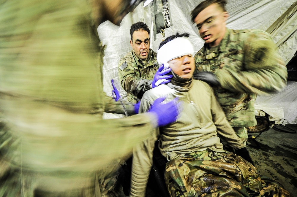 Paratroopers work on patient