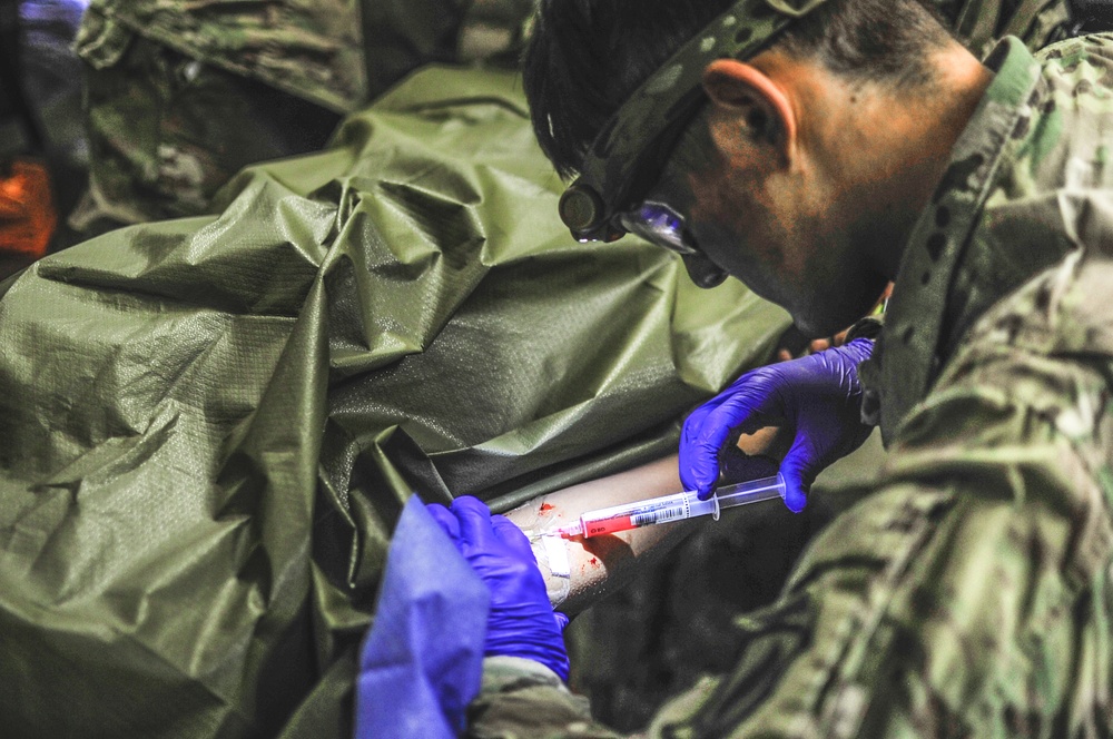 Sky Soldier injects casualty during exercise