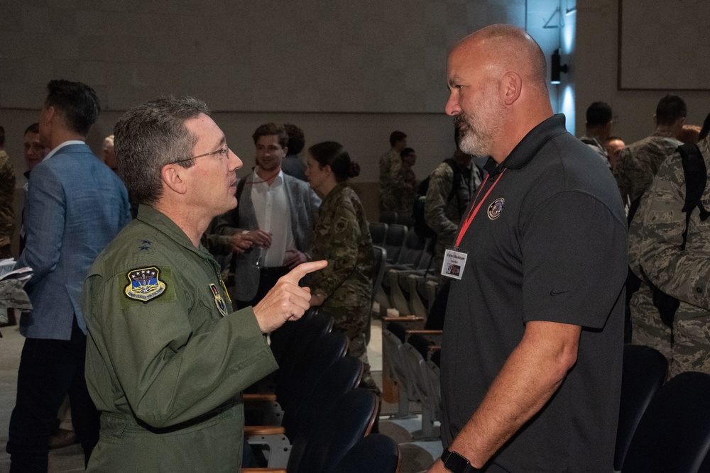 Maj Gen Rothstein talks with CMSgt (Ret) Markham