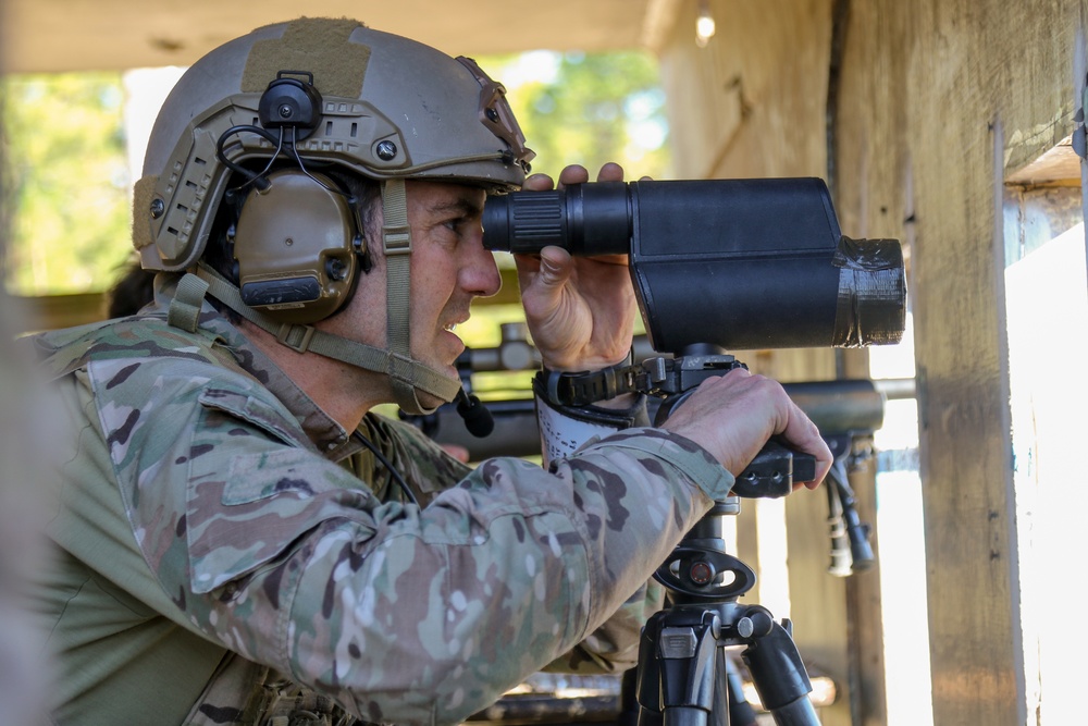Sniper using the M151 spotting scope