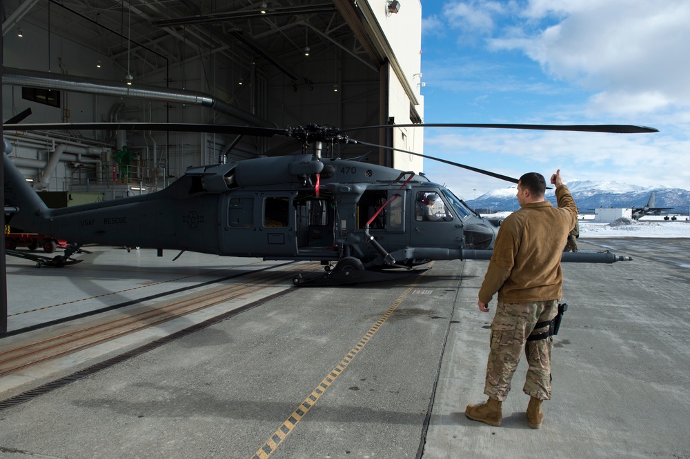 Alaska Air National Guardsmen prepare for aerial gunnery training at JBER