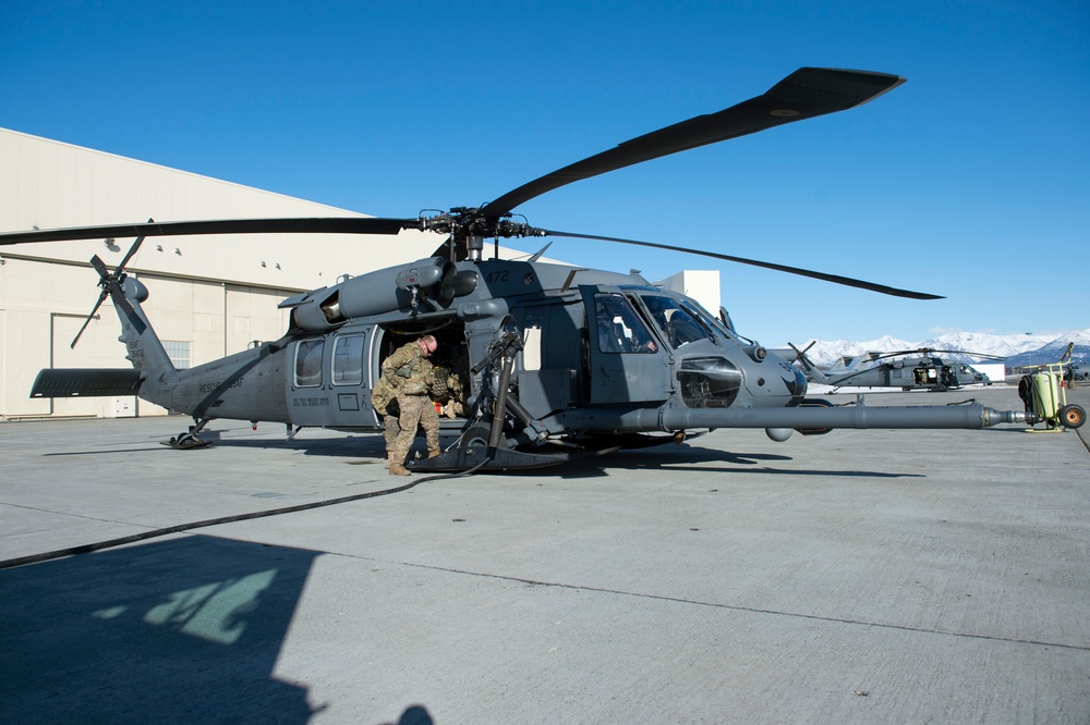 Alaska Air National Guardsmen prepare for aerial gunnery training at JBER