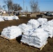 Airmen fill sandbags for flood relief