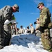 Airmen fill sandbags for flood relief