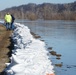 Airmen fill sandbags for flood relief