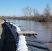 Airmen fill sandbags for flood relief