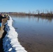 Airmen fill sandbags for flood relief