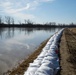 Airmen fill sandbags for flood relief