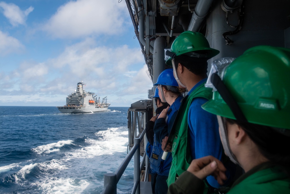 USS Harpers Ferry Conducts A Replenishment At Sea