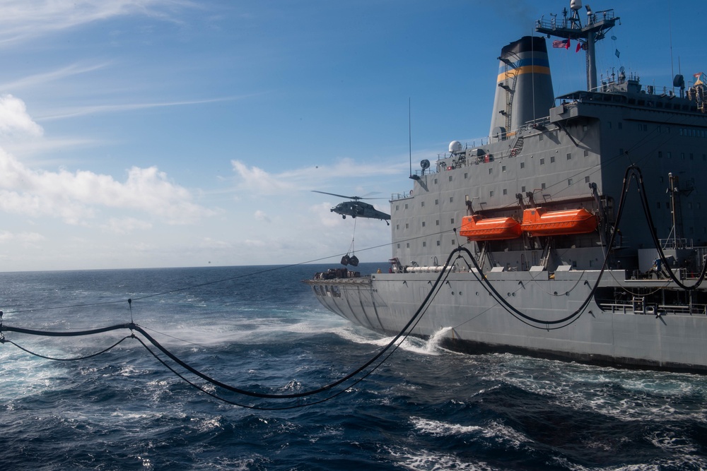 USS Harpers Ferry Conducts A Replenishment At Sea