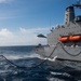 USS Harpers Ferry Conducts A Replenishment At Sea