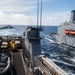 USS Harpers Ferry Conducts A Replenishment At Sea