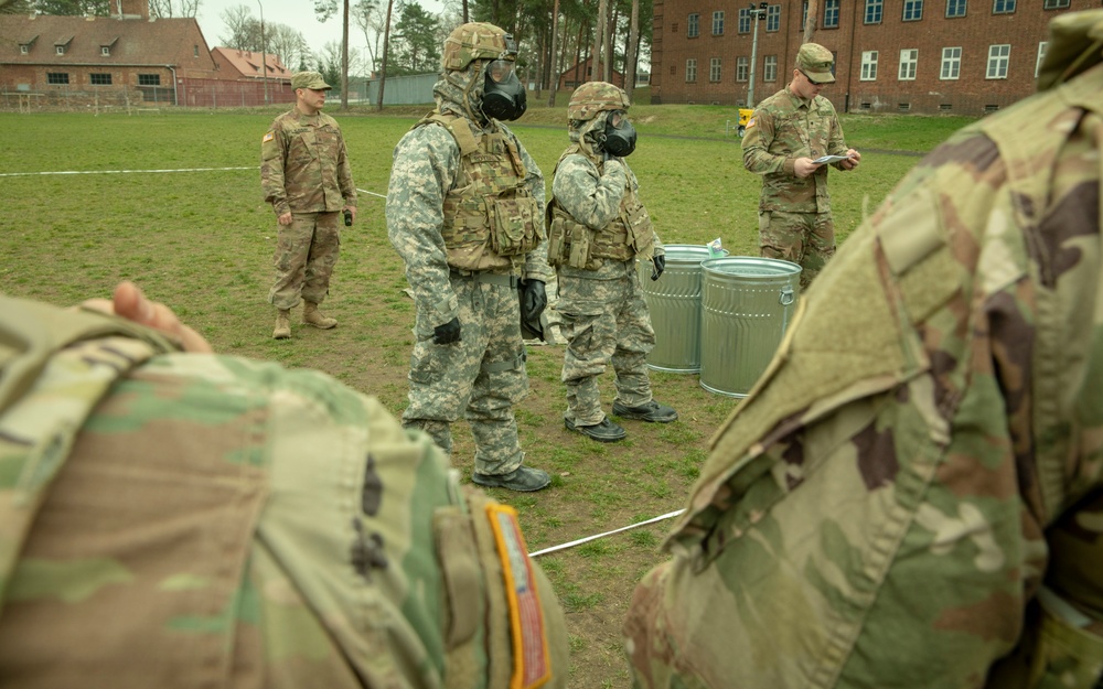 Soldiers from the 101st Brigade Support Battalion learn how to decontaminate themselves after potential chemical attacks.