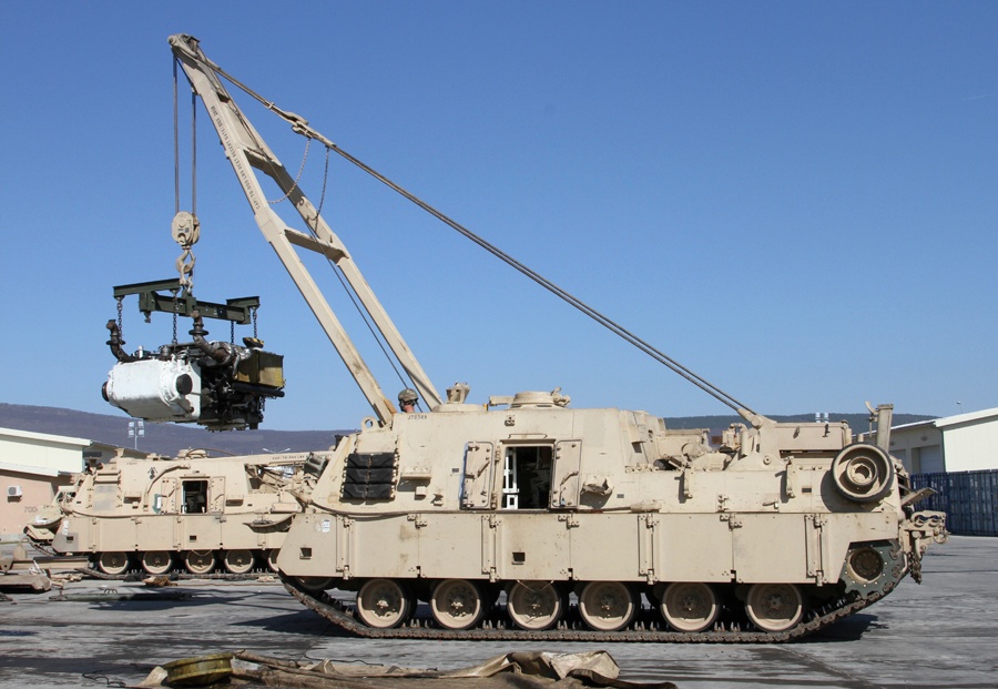A Soldier operates an M88A2 Heavy Equipment Recovery Combat Utility Lifting Extraction System during services and maintenance 