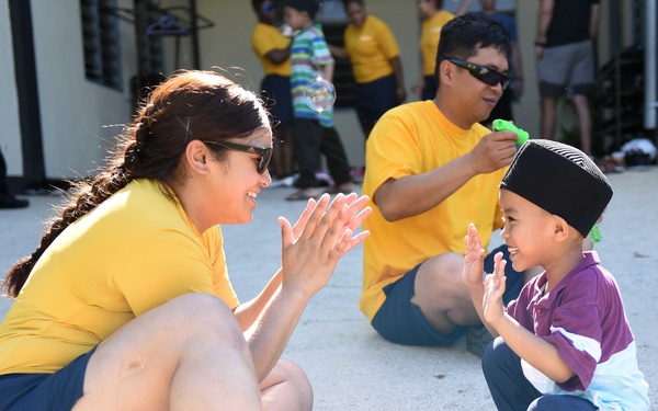 USS Blue Ridge Sailors participate in a community relations event at Rumah Nur Kasih Langkawi Orphanage