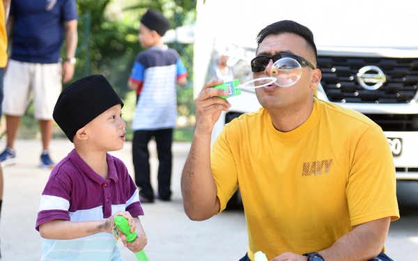 USS Blue Ridge Sailors participate in a community relations event at Rumah Nur Kasih Langkawi Orphanage