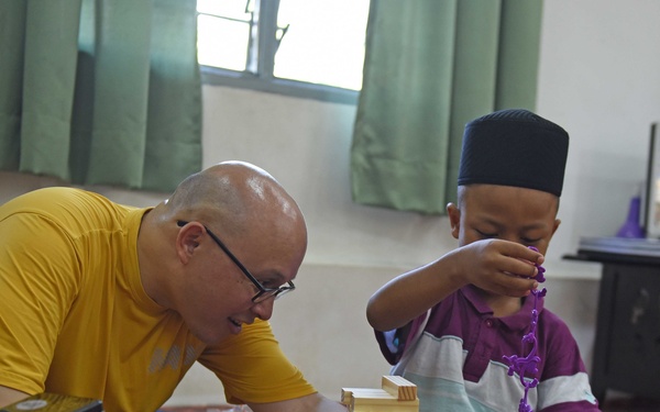 USS Blue Ridge Sailors participate in a community relations event at Rumah Nur Kasih Langkawi Orphanage