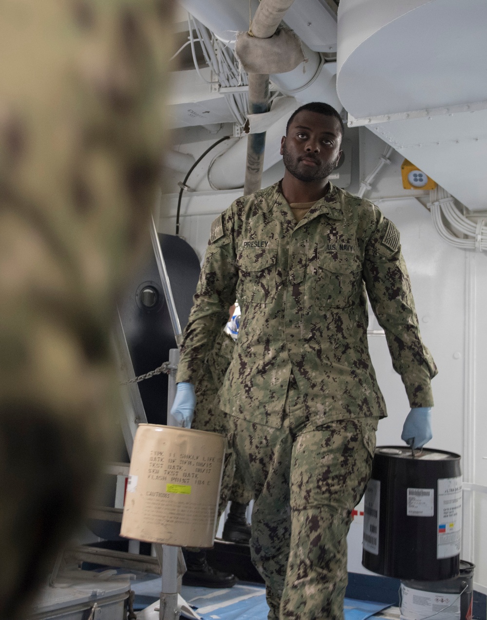 USS Makin Island Sailors move supplies aboard the ship.
