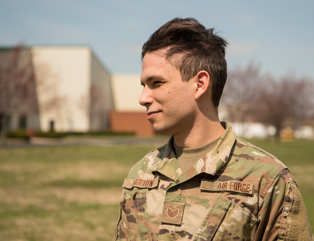 Photojournalist from 123rd Airlift Wing Poses to Demonstrate High-Speed Sync Technique