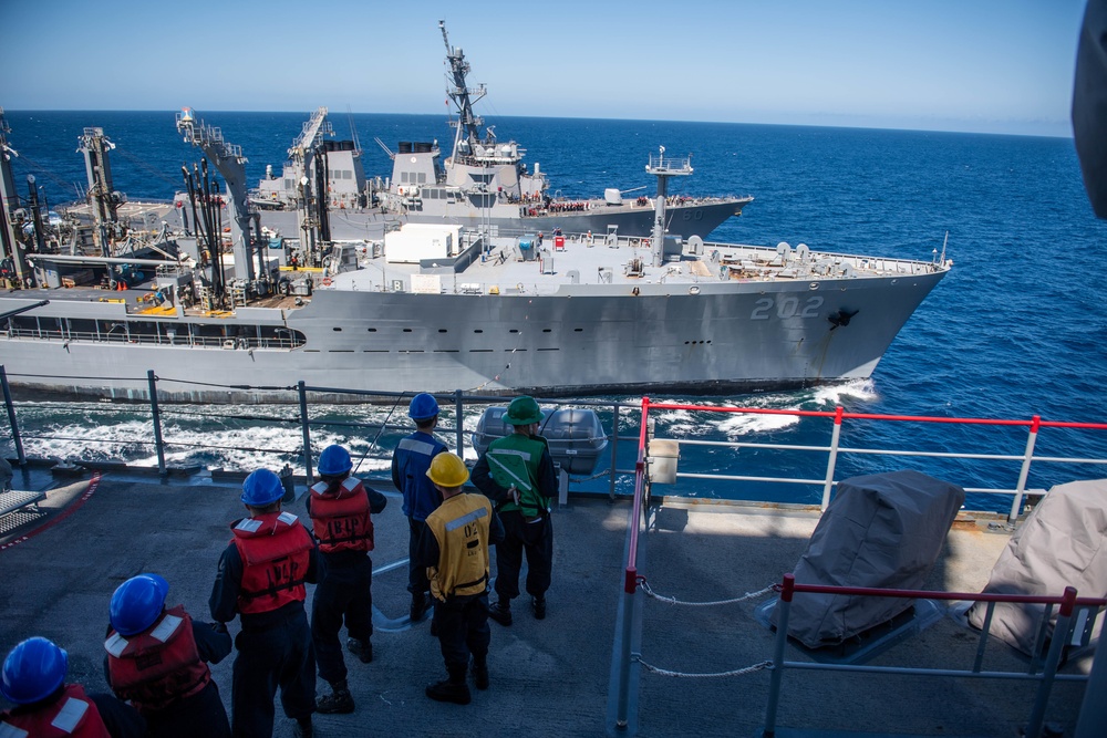 USS Harpers Ferry Conducts A Replenishment at Sea