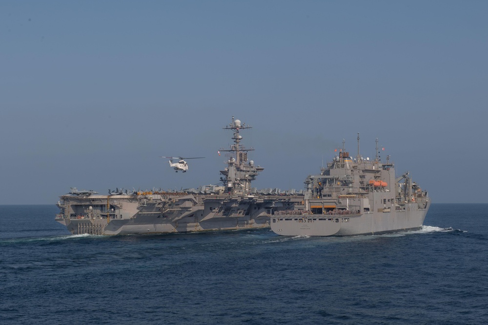 The aircraft carrier USS John C. Stennis (CVN 74) conducts a replenishment-at-sea with the dry cargo and ammunition ship USNS Richard E. Byrd (T-AKE 4)