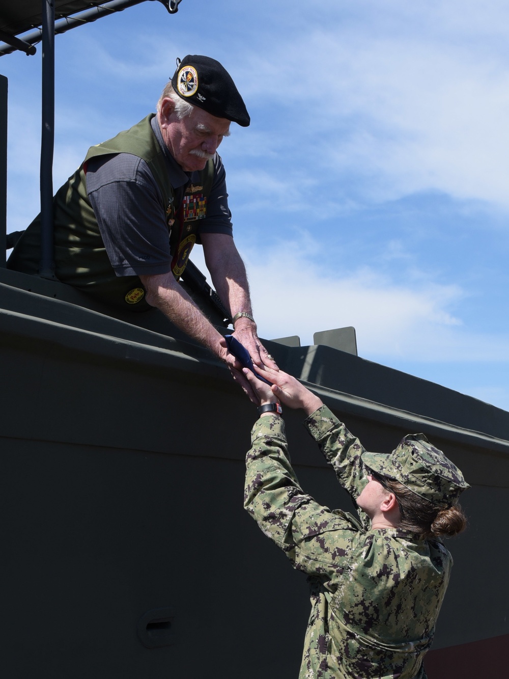 Banner hand off during Vietnam Commemoration