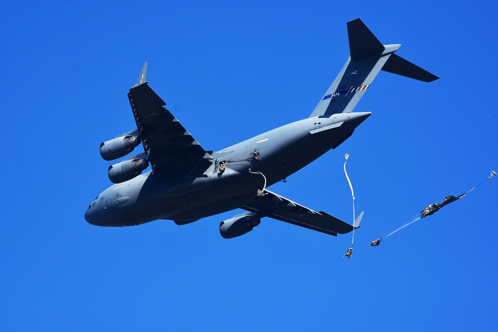 Soldiers jump out of C-17