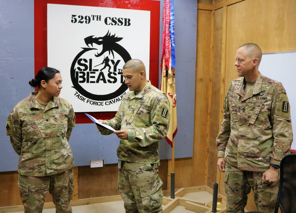 Task Force Cavalier Coin Presentation for Spc. Tiffani Keenan and Spc. Corey Burdeski