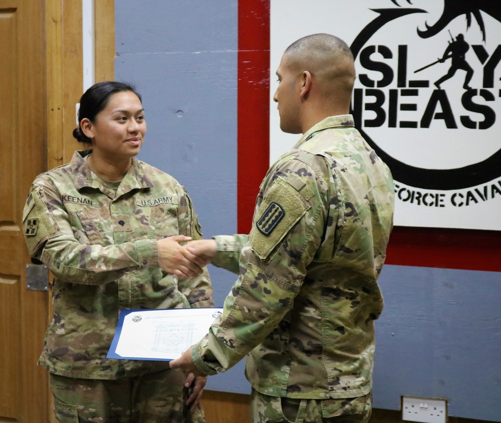 Task Force Cavalier Coin Presentation for Spc. Tiffani Keenan and Spc. Corey Burdeski