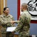 Task Force Cavalier Coin Presentation for Spc. Tiffani Keenan and Spc. Corey Burdeski