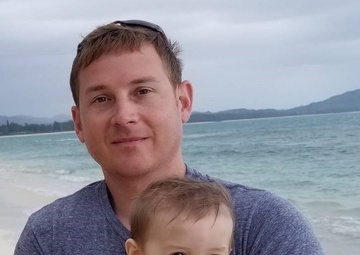 Always on duty: Soldier renders first aid to Korean boy