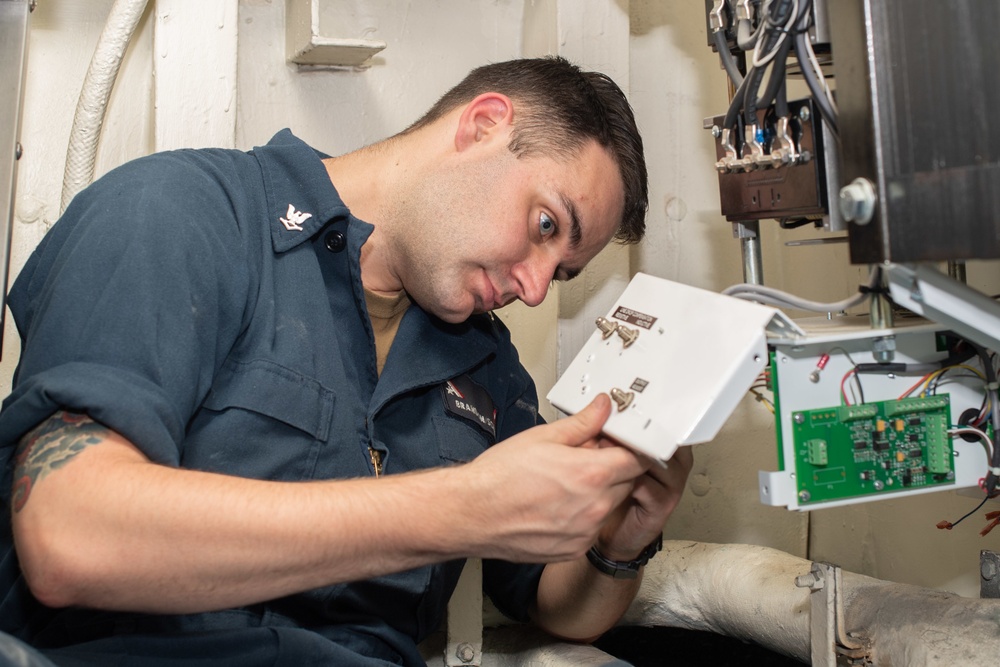 U.S. Sailor replaces a transformer