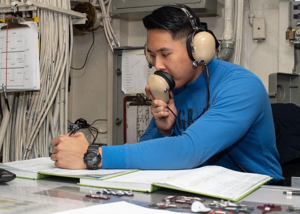 U.S. Sailor logs aircraft movement