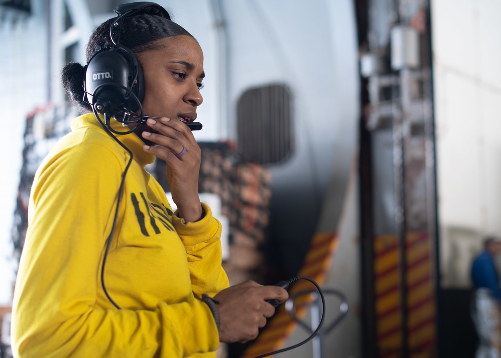 U.S. Sailor communicates with flight deck control