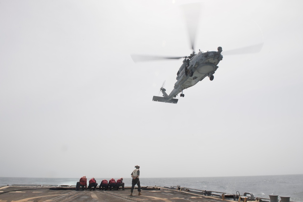 An MH-60R Sea Hawk approaches the flight deck of USS Spruance