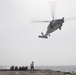 An MH-60R Sea Hawk approaches the flight deck of USS Spruance