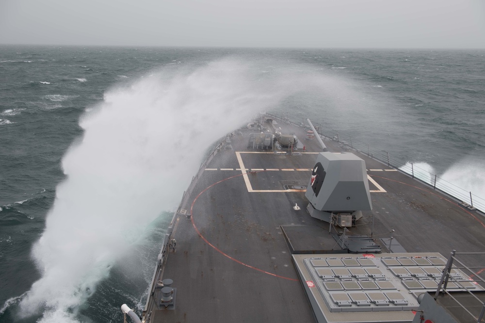 The guided-missile destroyer USS Chung-Hoon (DDG 93) cuts through the Arabian Gulf