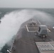 The guided-missile destroyer USS Chung-Hoon (DDG 93) cuts through the Arabian Gulf