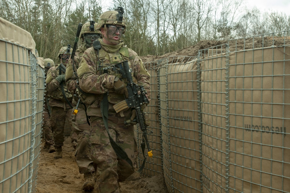 Charlie Company advances to clear trench objective.