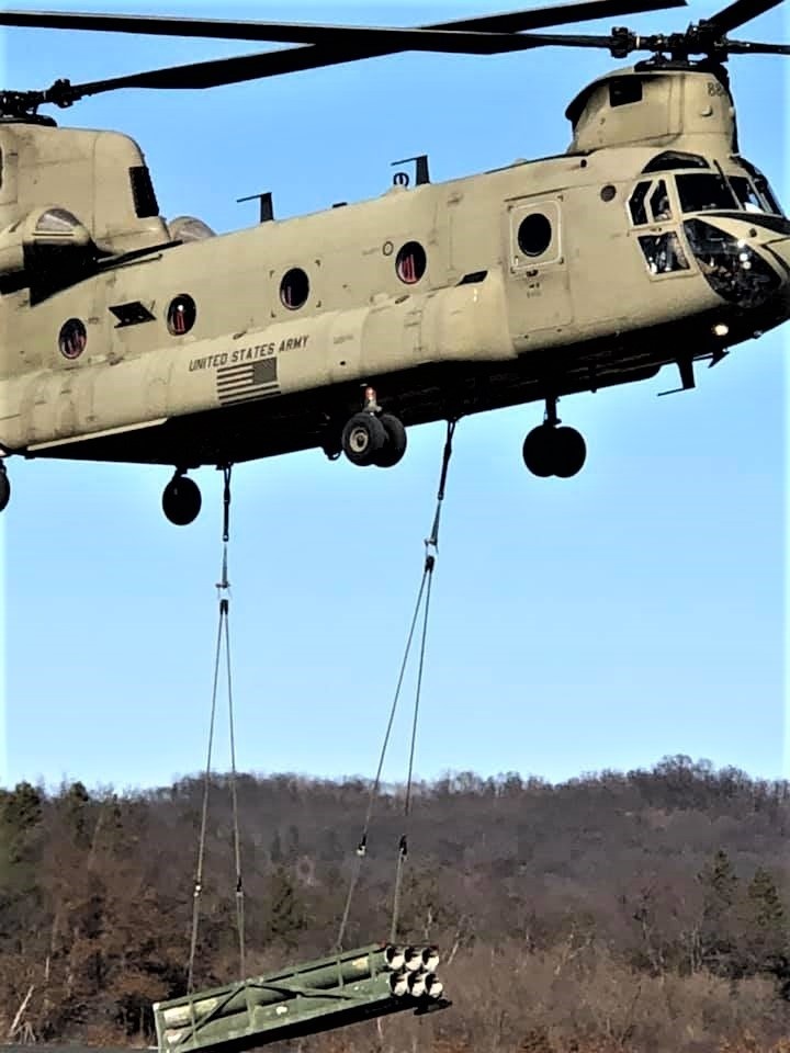 Chinook helicopter, crew, students combined for sling-load training supporting 89B course