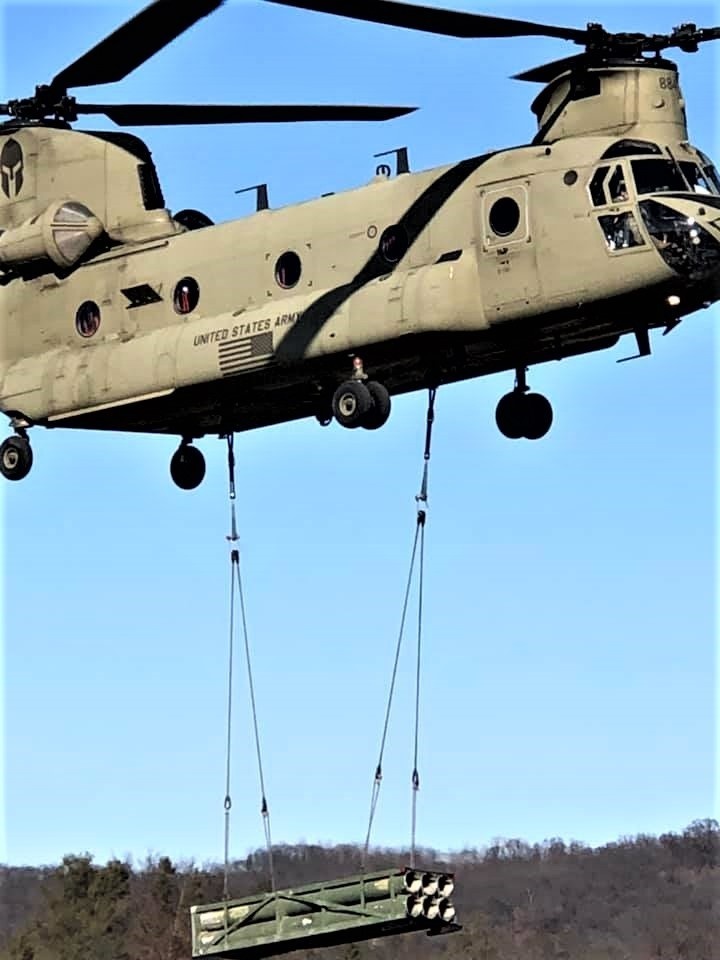 Chinook helicopter, crew, students combined for sling-load training supporting 89B course