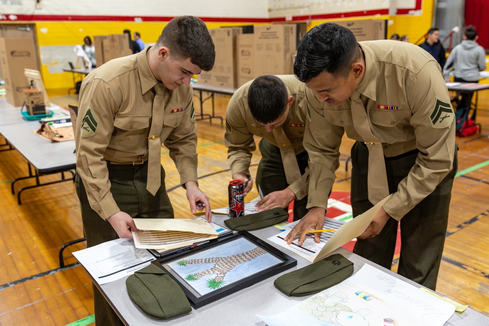 Marines and civilians judge STEAM Fair submissions