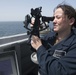 U.S. Navy Quarter Master Seaman uses a sextant aboard USS Spruance