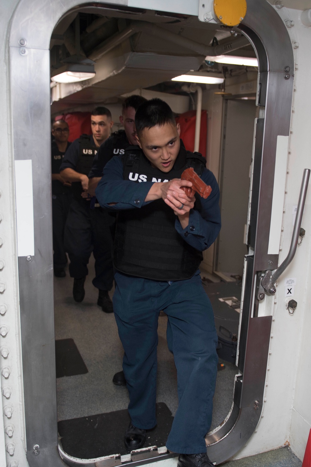 A security reaction force aboard USS Spruance (DDG 111) responds to a security threat during an anti-terrorism force protection drill