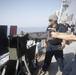 U.S. Navy Sonar Technician (Surface) fires a .50-caliber machine gun