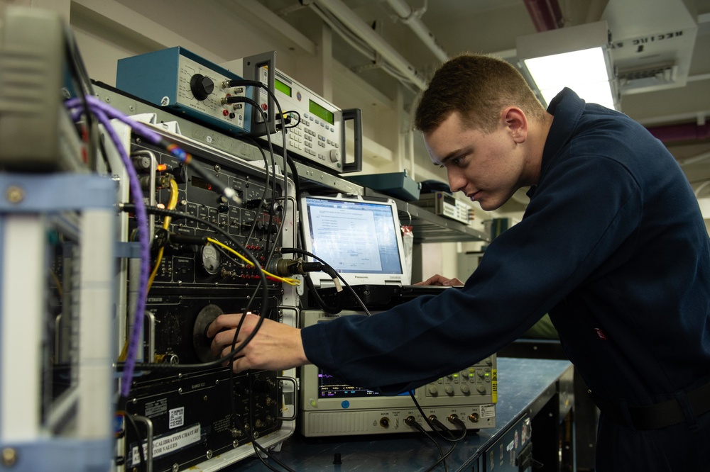 U.S Sailor calibrates a radar altimeter