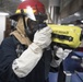 U.S. Navy Sailors respond to a simulated fire during a damage control training evolution aboard the guided-missile destroyer USS Spruance (DDG 111)