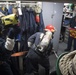 U.S. Navy Sailors engage simulated casualties during a general quarters drill aboard the USS Spruance.